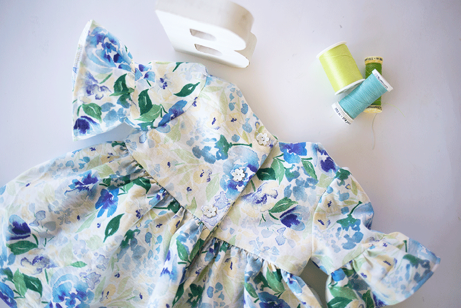 This simple pattern hack will show you how to make a darling on-trend bell sleeve baby dress DIY for the little bundle of joy! Take a break from pink by using this beautiful blue and green floral fabric; it's the perfect addition to any little girls' wardrobe. Read on for the ruffle sleeve tutorial and details on this gorgeous quilting cotton.eautiful blue and green floral fabric; it's the perfect addition to any little girls' wardrobe. Read on for the ruffle sleeve tutorial and details on this gorgeous quilting cotton.