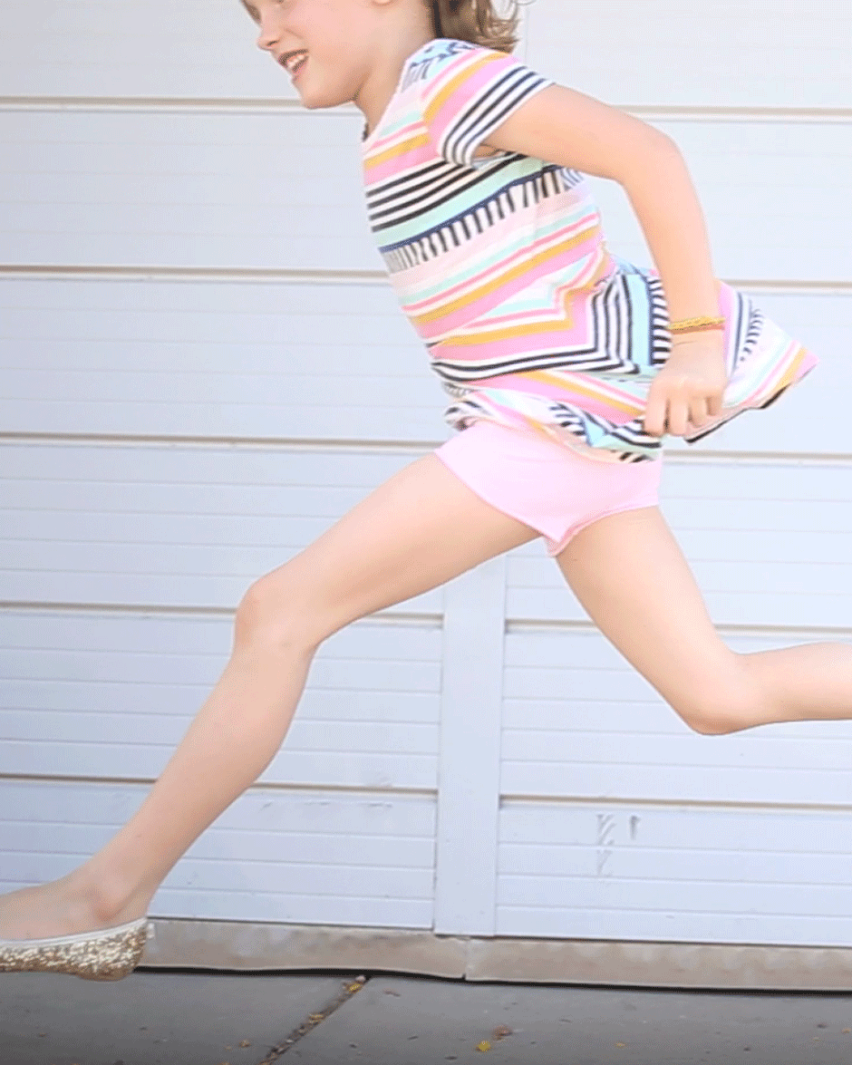 Who wants to learn how to sew modesty shorts? If you have a little girl who loves dresses, chances are you've found yourself in need of some cute little knit shorts to cover her goods while she flips around on the playground. Your search is over! You can make a handful of these cute shorts in just an afternoon with this simple tutorial for creating your own free pattern and using less than a yard of fabric. Plus, I've got a brand new video to show you how!